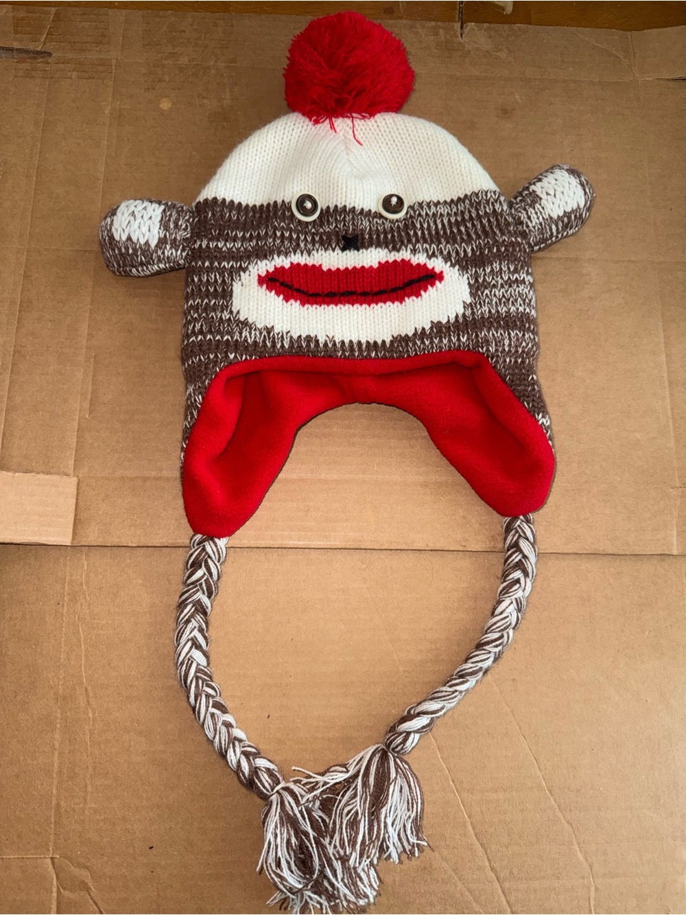 One size Knit Sock Monkey winter hat with smiley mouth and ears. A29
